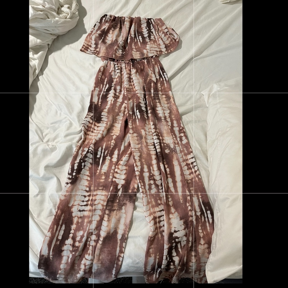 Strapless pant jumpsuit. Stretchy top. Can be dressed up or down!